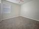 Bedroom with neutral carpet, a ceiling fan, a window, and ample natural light at 2164 Crosston Cir, Orlando, FL 32824