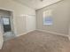 Cozy bedroom featuring neutral carpet, ceiling fan, and closet at 2164 Crosston Cir, Orlando, FL 32824
