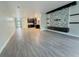 Bright, open-concept living space with tile floors, flowing into the kitchen and entryway at 2164 Crosston Cir, Orlando, FL 32824