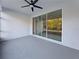 Covered patio with gray flooring and views of the outdoors at 2164 Crosston Cir, Orlando, FL 32824