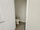 Compact half bathroom with tile flooring and a simple toilet at 2164 Crosston Cir, Orlando, FL 32824