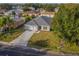 Aerial view of a single-story home featuring a well-manicured lawn at 246 Cheshire Ct, Kissimmee, FL 34758