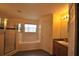 Spacious bathroom with a garden tub, glass enclosed shower, vanity, and wood-look flooring at 257 Lancaster Dr, Davenport, FL 33897