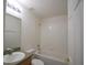 A well-lit bathroom featuring a vanity, toilet, and shower-tub combo at 257 Lancaster Dr, Davenport, FL 33897