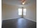 Bright bedroom featuring two windows allowing ample light, ceiling fan, and light gray wood-look flooring at 257 Lancaster Dr, Davenport, FL 33897