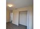 Bedroom featuring a built-in closet and neutral paint, ready for personalization at 257 Lancaster Dr, Davenport, FL 33897