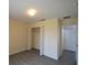Cozy bedroom with a standard closet and access to the hallway at 257 Lancaster Dr, Davenport, FL 33897