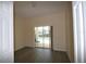 Bright bedroom with sliding glass door and view of the pool area at 257 Lancaster Dr, Davenport, FL 33897