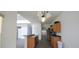 Bright kitchen features wood cabinets, stainless steel appliances, and a breakfast bar at 257 Lancaster Dr, Davenport, FL 33897