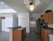 Bright kitchen features wood cabinets, stainless steel appliances, and a breakfast bar at 257 Lancaster Dr, Davenport, FL 33897