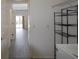 Practical laundry area with washer, dryer, and shelving offering ample storage solutions at 257 Lancaster Dr, Davenport, FL 33897