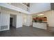 Bright living room with an open floor plan, wood floors, and high ceilings overlooked by a second-story balcony at 257 Lancaster Dr, Davenport, FL 33897