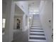 A bright staircase leads to the second floor at 257 Lancaster Dr, Davenport, FL 33897