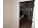 Bathroom view with wood vanity, sink, and glass-enclosed shower at 3001 Greystone Loop # 106, Kissimmee, FL 34741