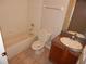 Full bathroom featuring a tub/shower, vanity, and toilet at 3001 Greystone Loop # 106, Kissimmee, FL 34741