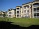 Multi-Gathering apartment building with manicured lawn and patios at 3001 Greystone Loop # 106, Kissimmee, FL 34741