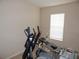 Bright room is shown featuring gym equipment, ready for workouts at 3001 Greystone Loop # 106, Kissimmee, FL 34741