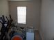 Well-lit gym features exercise equipment, perfect for a home fitness space at 3001 Greystone Loop # 106, Kissimmee, FL 34741