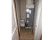 HVAC unit with water heater in a utility closet of the home at 3001 Greystone Loop # 106, Kissimmee, FL 34741
