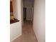 Hallway with neutral carpet leading to different rooms of the house at 3001 Greystone Loop # 106, Kissimmee, FL 34741