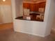 Kitchen with wood cabinets and white appliances at 3001 Greystone Loop # 106, Kissimmee, FL 34741