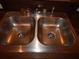 Stainless steel double-basin kitchen sink with chrome faucet, ready for meal prep and easy cleanup at 3001 Greystone Loop # 106, Kissimmee, FL 34741