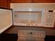 White microwave above a white range at 3001 Greystone Loop # 106, Kissimmee, FL 34741