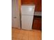 A white refrigerator in a kitchen with tile floors at 3001 Greystone Loop # 106, Kissimmee, FL 34741