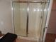 Clean, glass-enclosed shower stall in bathroom with neutral tile at 3001 Greystone Loop # 106, Kissimmee, FL 34741