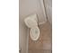 Top-down shot of toilet with raised seat and tile flooring at 3001 Greystone Loop # 106, Kissimmee, FL 34741
