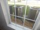 A view from the window shows the air conditioning infrastructure outside at 3001 Greystone Loop # 106, Kissimmee, FL 34741