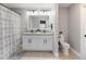 Clean bathroom features a double sink vanity with granite counters and modern fixtures at 3211 Sweet Acres Pl, St Cloud, FL 34772