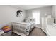 Inviting bedroom with a cozy bed, dresser, and a motivational wall decal at 3211 Sweet Acres Pl, St Cloud, FL 34772