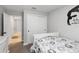 Bedroom featuring closet, dresser and an inspirational wall decal, offering comfort at 3211 Sweet Acres Pl, St Cloud, FL 34772