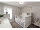 Charming bedroom with built-in shelves, decorative art, and bright window at 3211 Sweet Acres Pl, St Cloud, FL 34772