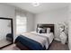 Stylish bedroom showcasing a comfortable bed, contemporary decor, and natural light at 3211 Sweet Acres Pl, St Cloud, FL 34772