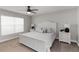 Cozy bedroom featuring a plush bed, contemporary ceiling fan, and natural light at 3211 Sweet Acres Pl, St Cloud, FL 34772
