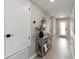 Hallway with wood floors, a decorative mirror, and neutral wall color at 3211 Sweet Acres Pl, St Cloud, FL 34772
