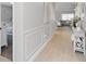 Hallway featuring wood floors, decorative wall trim, and neutral wall color at 3211 Sweet Acres Pl, St Cloud, FL 34772