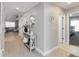Hallway with wood floors leading to the living room and bedrooms at 3211 Sweet Acres Pl, St Cloud, FL 34772