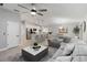 Spacious living area showcasing open layout to kitchen, eat-in kitchen and comfortable seating at 3211 Sweet Acres Pl, St Cloud, FL 34772