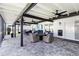 Spacious screened patio with elegant seating, ceiling fans, and a view of the yard at 3211 Sweet Acres Pl, St Cloud, FL 34772