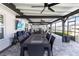 Large screened-in patio with outdoor kitchen, dining area, and comfortable lounge space at 3211 Sweet Acres Pl, St Cloud, FL 34772