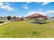 Community playground with covered picnic area, colorful play structures, and open green space at 3211 Sweet Acres Pl, St Cloud, FL 34772