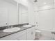 Bright bathroom featuring double sinks, granite counters, and a shower/tub combo at 3214 Viceroy Ct, Kissimmee, FL 34759