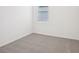 Neutral bedroom featuring carpeted floors, a window and white walls at 3214 Viceroy Ct, Kissimmee, FL 34759