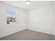 Neutral bedroom featuring carpeted floors, a window and white walls at 3214 Viceroy Ct, Kissimmee, FL 34759