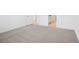 Clean, carpeted bedroom with neutral tones and a view to an adjoining bathroom at 3214 Viceroy Ct, Kissimmee, FL 34759