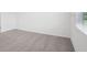 Neutral bedroom featuring carpeted floors, a window and white walls at 3214 Viceroy Ct, Kissimmee, FL 34759