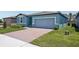Charming single-story home with a brick driveway and a two-car garage at 3214 Viceroy Ct, Kissimmee, FL 34759